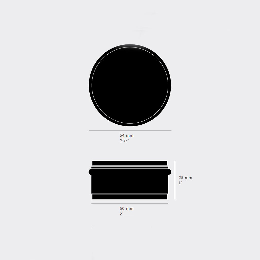 Eksklusiv dørstopper til gulvmontering fra Buster + Punch i massiv bruneret messing (smoked bronze) med diamond cut (cross) mønster