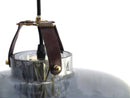 Lampen har en røgfarvet glasskærm i mundblæst glas, et facetslebet cylinderrør samt unikke detaljer i bl.a. læder.