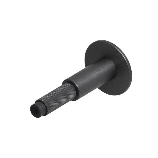 Cross Wall dørstopper i bruneret messing (smoked bronze) med diamond cut mønster • Buster + Punch